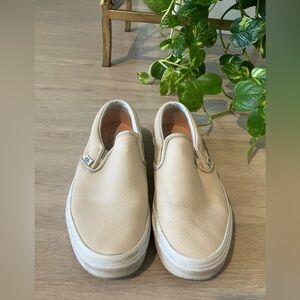 Vans Cream Slip-On Sneakers